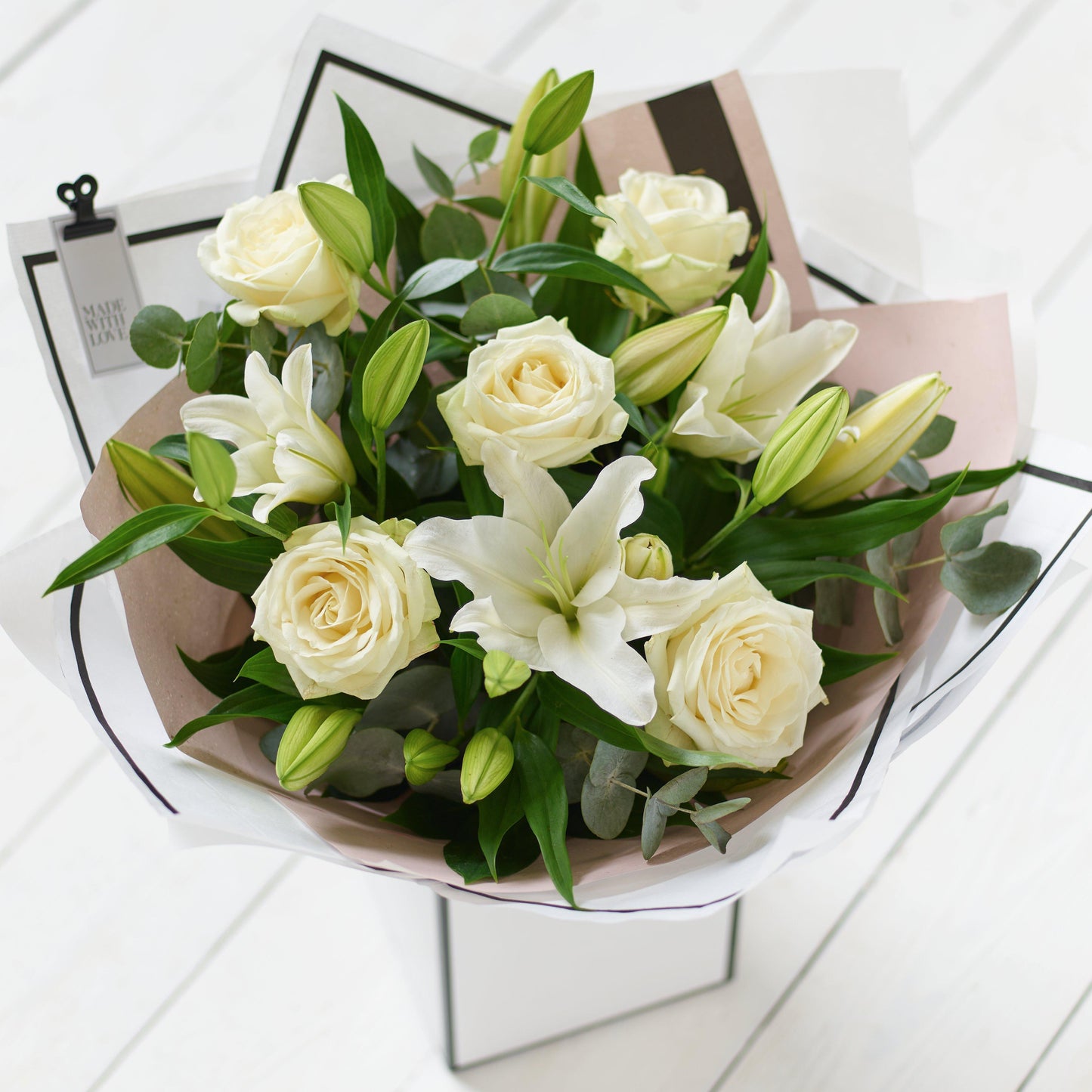 
                  
                    Beautifully Simple White Rose and Lily Bouquet
                  
                