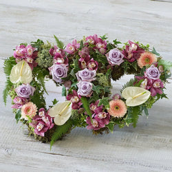 Deluxe Double Heart funeral tribute with orchids, anthuriums and lilac roses