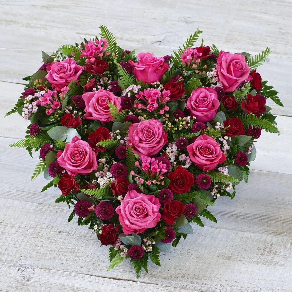 Cerise Rose Heart funeral tribute with rich pink and red roses