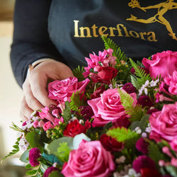 Close-up of Cerise Rose Heart funeral flower arrangement