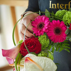 Detail of contemporary heart tribute with sculptural flowers